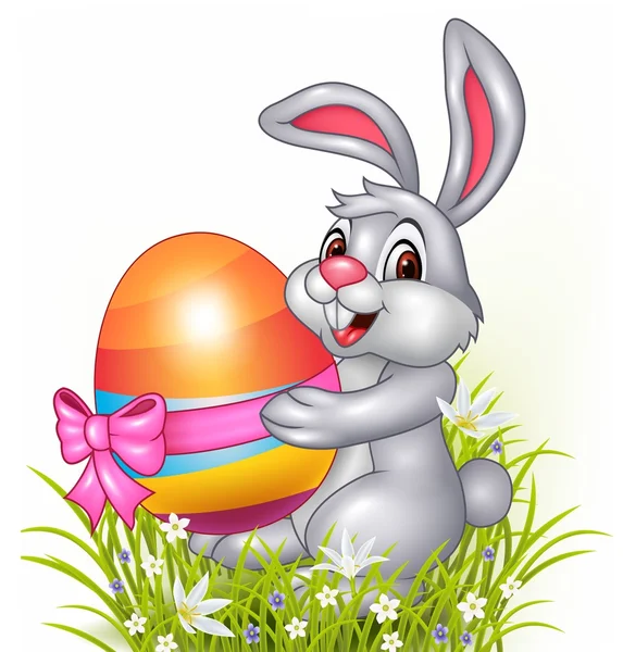 Lindo conejito sosteniendo huevos de Pascua — Vector de stock