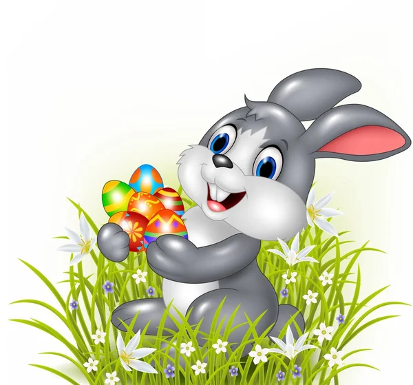 Šťastný kreslený zajíček drží velikonoční vejce — Stockový vektor