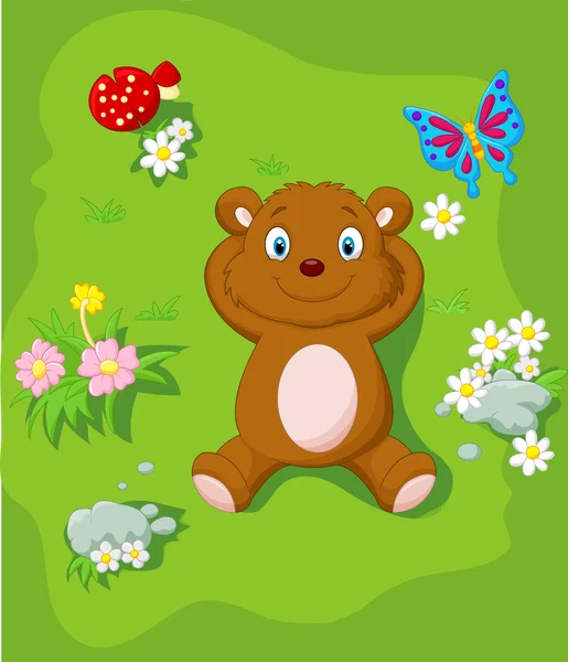 Happy Bear Cartoon im Gras liegend — Stockvektor