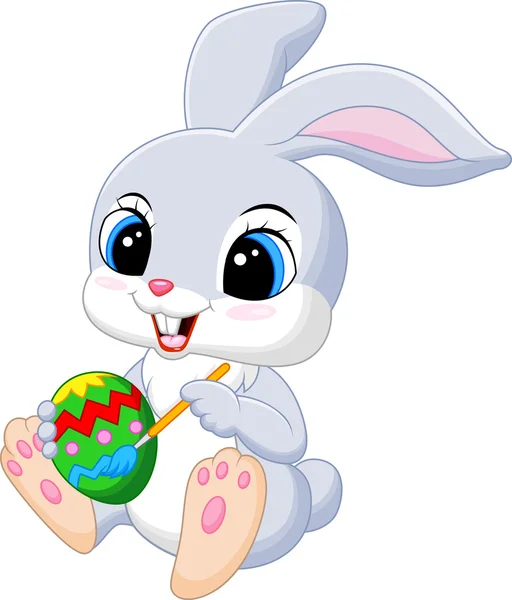 Bonito coelho da Páscoa desenhos animados pintando um ovo — Vetor de Stock