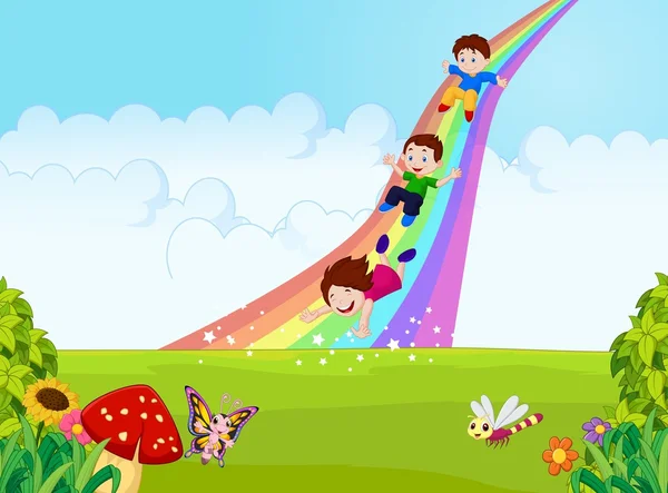 Dibujos animados niños pequeños jugando arco iris de diapositiva en la selva — Vector de stock