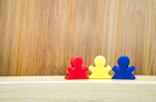 Three meeples in concept of family game — Stock Photo, Image