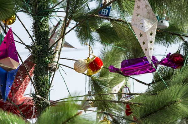 Decoration items on christmas tree — Stock Photo, Image