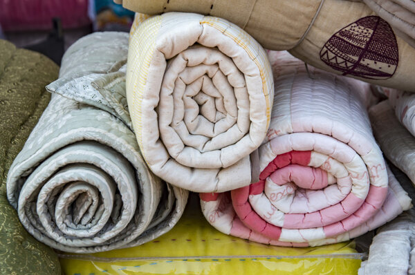 Rolled blankets on sale.