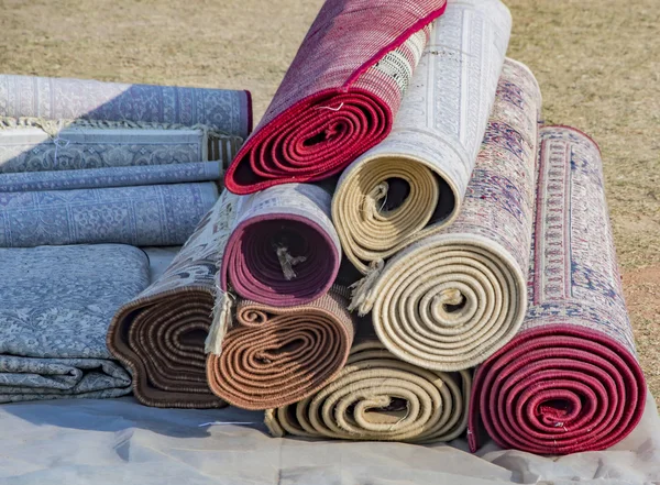 Rolled carpets on the ground. — Stock Photo, Image
