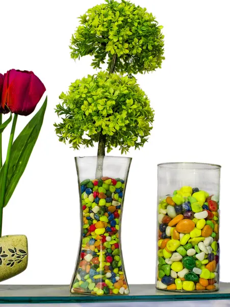 Fake tree in the vase with stones — Stock Photo, Image