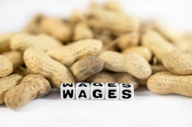 Wages text with peanuts and letters clipart