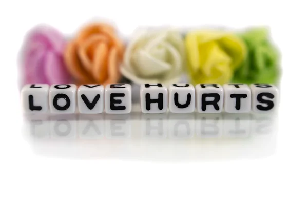 Love hurts with black text — Stock Photo, Image