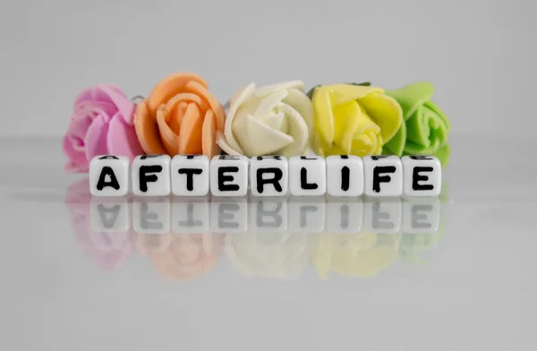 Afterlife text message with beads and flowers — Stock Photo, Image