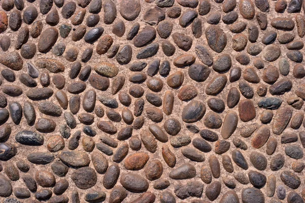 壁の丸い石の岩のテクスチャとシームレスな背景. — ストック写真