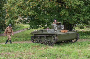 Gatchina, Russia - September 11, 2016: The historical reconstruction of World War II. Lightweight floating tank T-37A. clipart