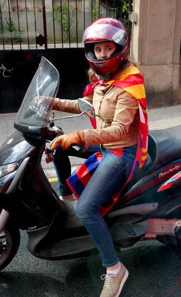 Barcelona, Spain - May 17, 2014: FC Barcelona fans on motor scooter