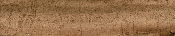 Modoc cultural petroglyphs carved into rock wall