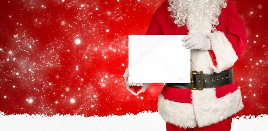 santa holds an empty white panel for advertising in the camera red background with snowflakes