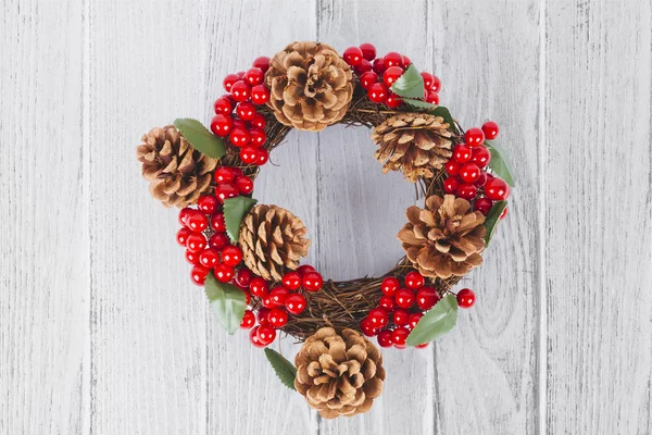 Christmas wreath on white wooden background — Stock Photo, Image