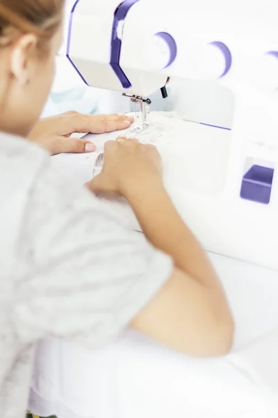 Close up young woman sewing — Stock Photo, Image