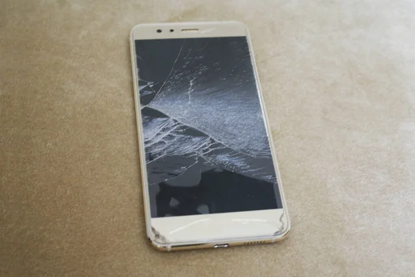 Broken phone screen, broken smartphone, crack in the screen.