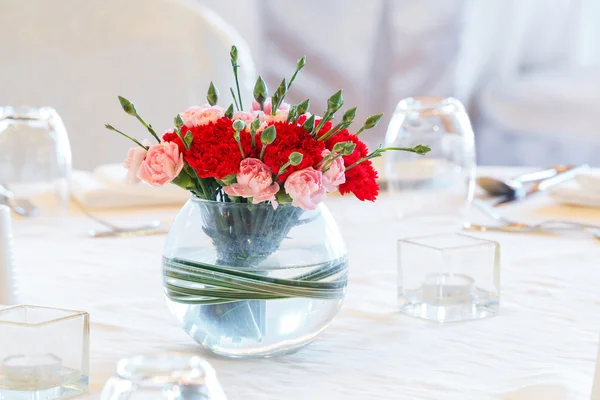 Carnation flower bouquet in glass vase — Stock Photo, Image