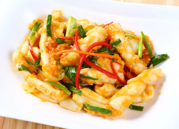 Stir fried squid with salted egg yolk — Stock Photo, Image