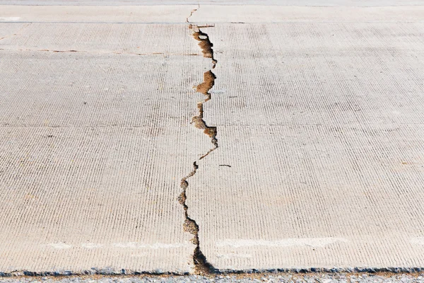 Cracked concrete road — Stock Photo, Image