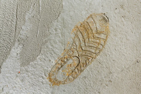 Footprint on wet concrete floor — Stock Photo, Image