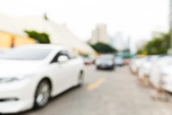 Abstrato carro embaçado na área de estacionamento — Fotografia de Stock