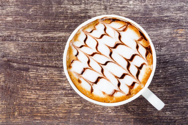 Tasse Kaffee auf altem Holztisch — Stockfoto