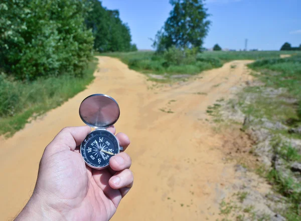 With compass on the walk. — Stock Photo, Image