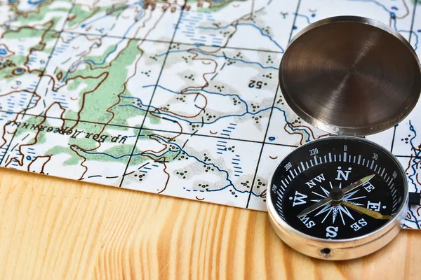 The magnetic compass and topographic map. — Stock Photo, Image