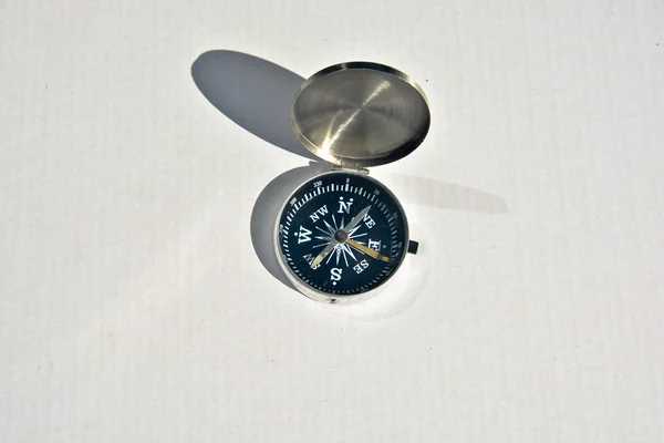Magnetic compass on a white background. — Stock Photo, Image