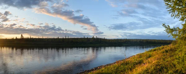 Panorama of the northern river. Water landscape, river on the eastern slope of the Polar Urals.