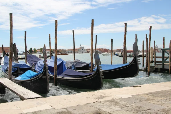 Venetian landscape with gondolas and mooring piles. — Stock Photo, Image