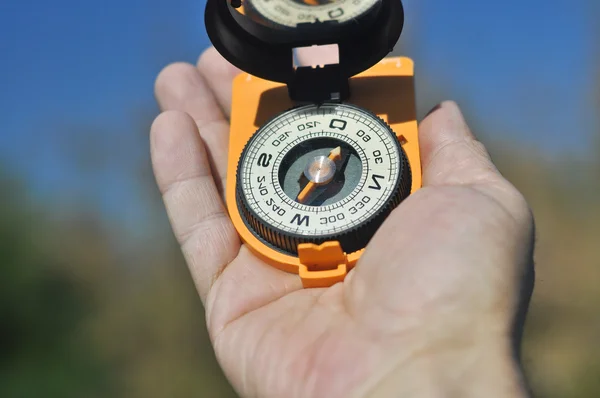 Compass in the palm of your hand. — Stock Photo, Image