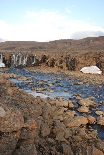 Landscape with rocks and a waterfall. — Stockfoto