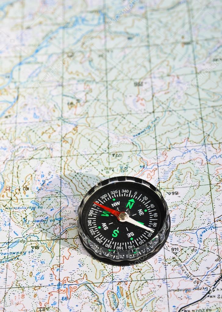 The compass and topographic map. — Stock Photo © sergunt 66415833