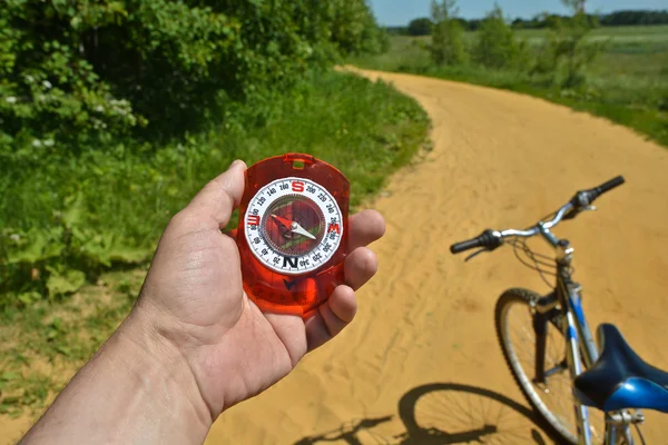 Compass and bike. — Stock Photo, Image