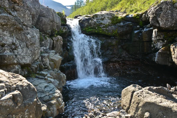 Putorana Plateau, a waterfall on the Grayling Stream. Mountain stream on a  cloudy day Stock Photo - Alamy