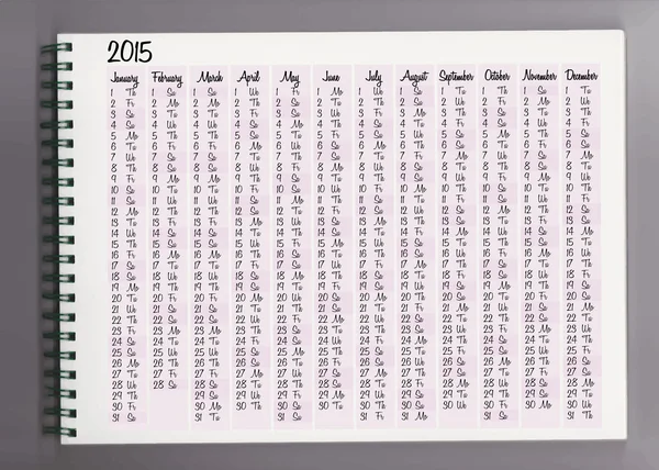 2015 kalender in een notitieblok — Stockvector