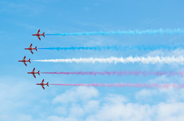 EASTBOURNE, ENGLAND - AUGUST 14, 2015: RAF aerobatic team The Red Arrows perform at the Airbourne airshow.