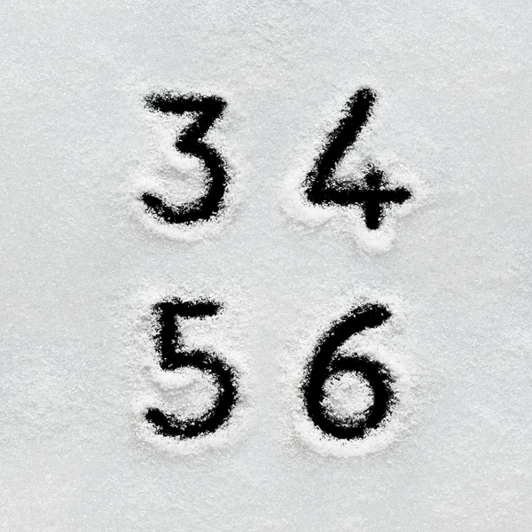 Winter alphabet, symbols and numbers hand written on snow. — Stock Photo, Image