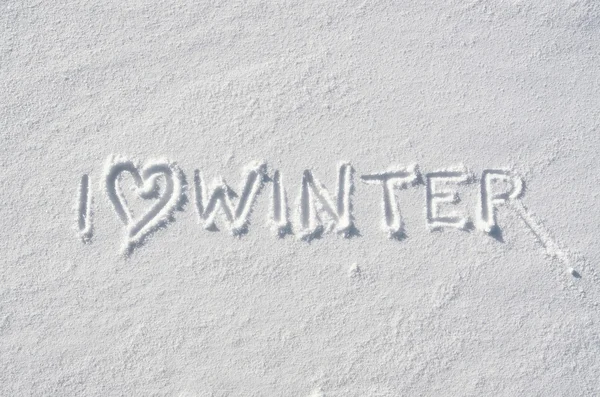 Text I LOVE WINTER and heart symbol hand written on snow background. Horizontal postcard template. — Stockfoto