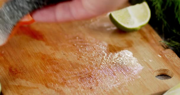 The mens hand puts a raw piece of salmon on the table. — Stock Footage The mens hand puts a raw piece of salmon on the table. Stock Footage