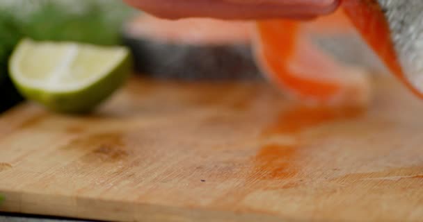 Salmon steak put on the table. — Stock Footage Salmon steak put on the table. Royalty Free Stock Video