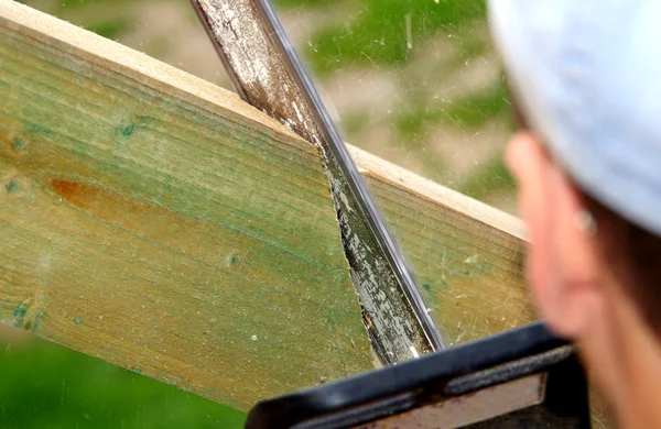 Sawing with a chainsaw — Stock Photo, Image