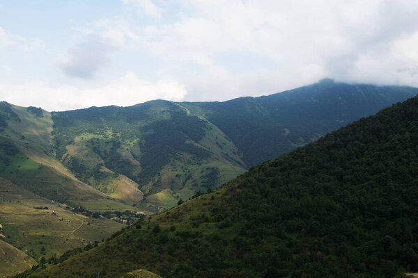 View of the mountains of the North Caucasus. Mountains in the clouds in summer