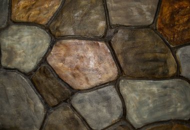 Taştan bir duvar. Yüze bakan taşların görüntüsü. Taşların arkaplanı