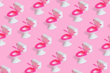 Pembe arka planda klozet deseni olan basit bir model. Yaratıcı temizlik, temizlik, komik tuvalet ve asgari tasarım fikri.