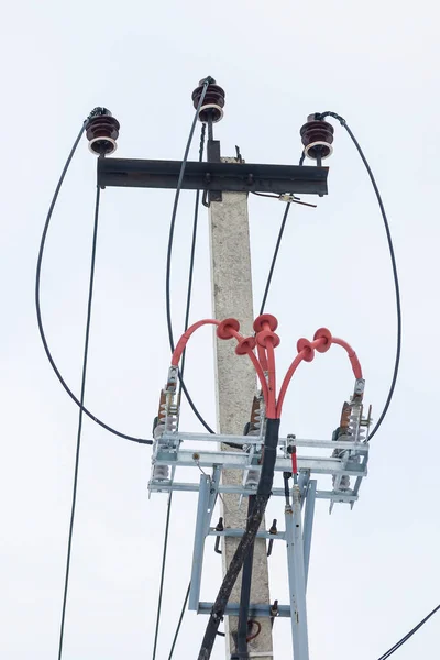 Supports of power lines. Power lines and posts. Detailed close-up.