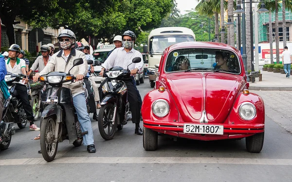 Old Red Beatle standing at the cross road