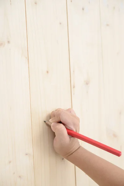 Kid Hand Houden Rood Potlood Schrijven Houten Vloer — Stockfoto